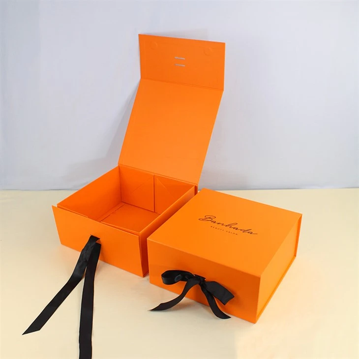 Afɛfɛde orange magnetic folding adaka a ribbon .